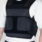 Protective vest showing adjustable Velcro straps and breathable outer cover.”
