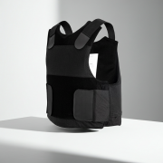 “Covert black NIJ Level IIIA bullet, stab and spike resistant vest displayed front view.”